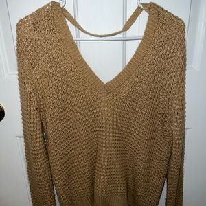 Long sweater could be worn as a dress or top depending on the person.